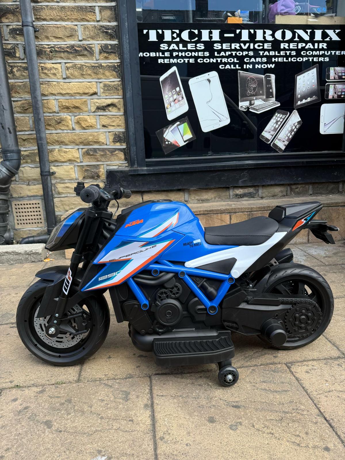 Kids 12v Ride on Electric Bike KTM Superduke Motor Bike with Stabilizers - Orange Blue